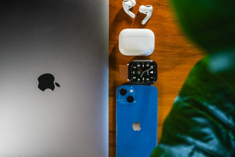 Apple laptop and AirPods representing AirPods Pro 3 and MacBook Air M5 deals