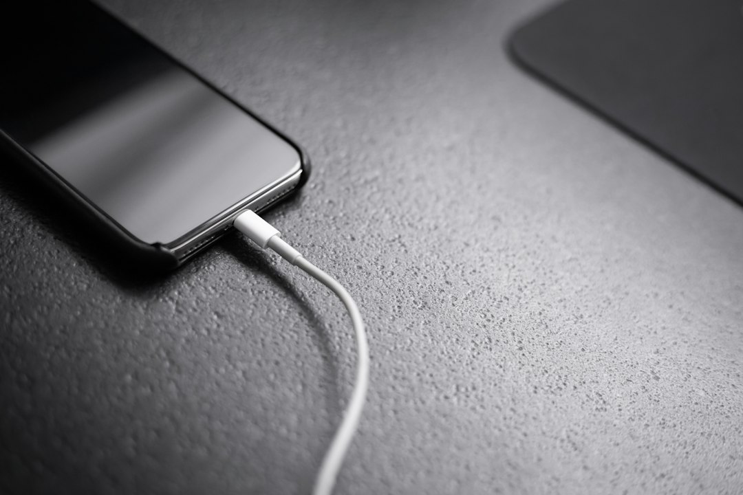 Smartphone connected to a charger